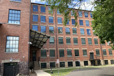 A former casket factory redeveloped as a multifamily residential building.